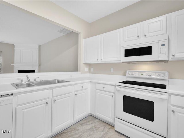 706 Canyon Lake Cir, Morrisville, NC 27560 - kitchen featuring visible vents, a sink, light countertops, white appliances, and white cabinetry