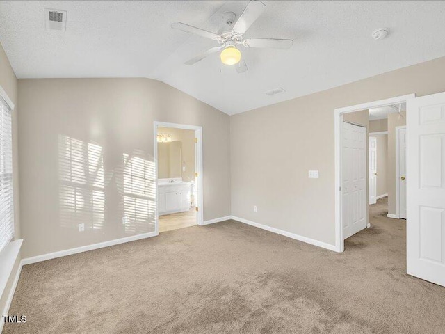 706 Canyon Lake Cir, Morrisville, NC 27560 - unfurnished bedroom featuring visible vents, lofted ceiling, baseboards, a ceiling fan, and carpet