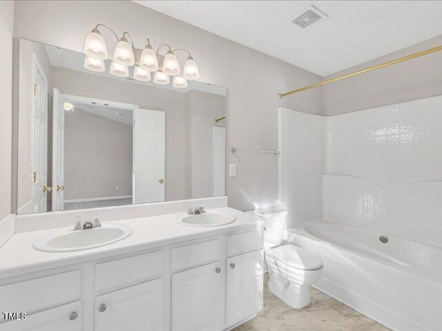 706 Canyon Lake Cir, Morrisville, NC 27560 - bathroom with double vanity, toilet, visible vents, and a sink