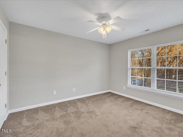 706 Canyon Lake Cir, Morrisville, NC 27560 - carpeted empty room featuring baseboards, ceiling fan, a textured ceiling, and visible vents