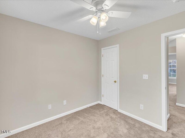 706 Canyon Lake Cir, Morrisville, NC 27560 - carpeted empty room with baseboards, a ceiling fan, and visible vents