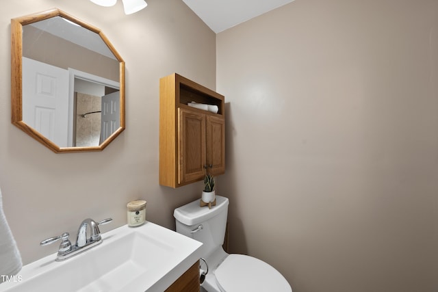 bathroom featuring toilet and vanity