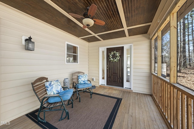 entrance to property featuring a ceiling fan