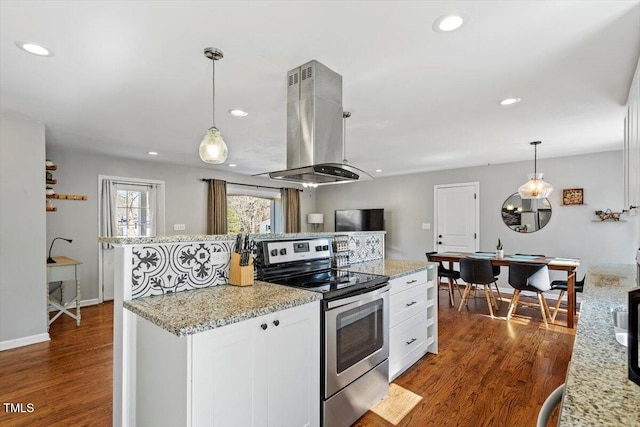 kitchen featuring dark wood finished floors, recessed lighting, white cabinets, island range hood, and stainless steel range with electric stovetop