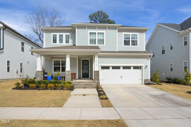 view of front facade featuring driveway, a garage, stone siding, a porch, and a front lawn