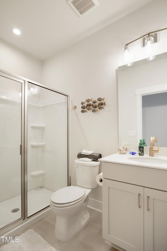 bathroom featuring visible vents, toilet, a shower stall, vanity, and tile patterned floors