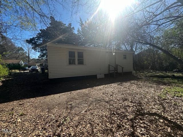 view of side of property with entry steps