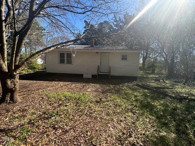 rear view of property featuring entry steps