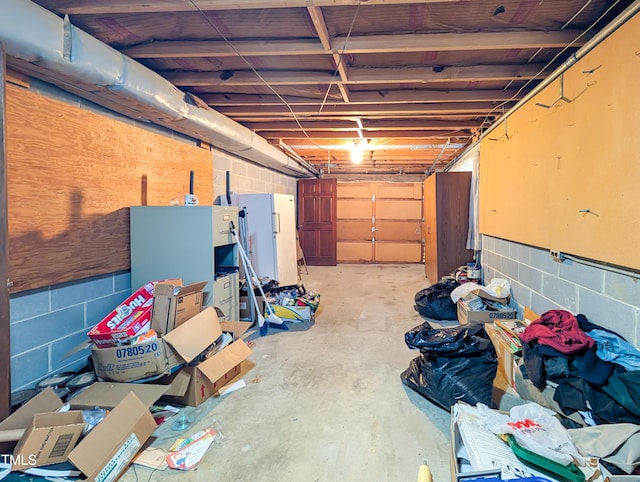 garage featuring concrete block wall