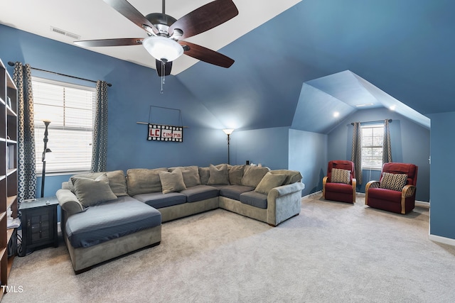 living room with lofted ceiling, ceiling fan, carpet flooring, visible vents, and baseboards