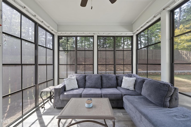 sunroom / solarium featuring ceiling fan