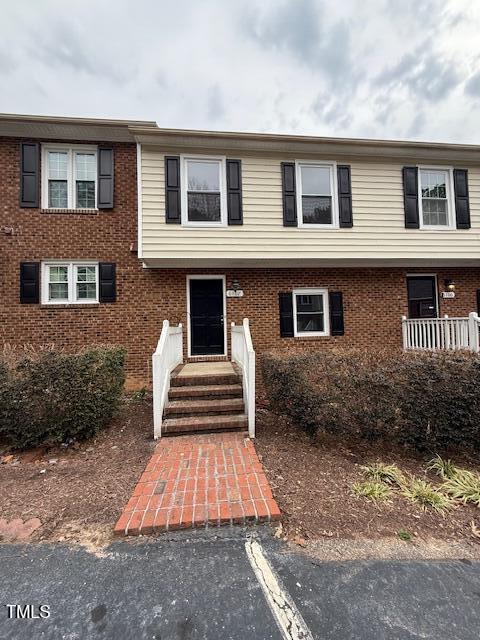 view of front of home featuring brick siding