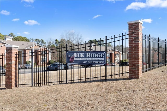 view of gate with fence