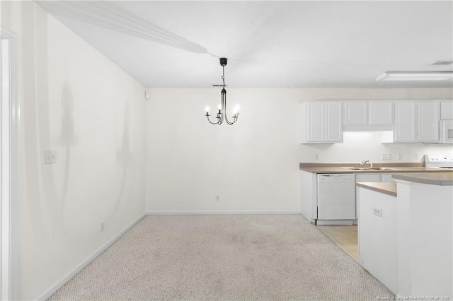 unfurnished dining area with baseboards, light carpet, a sink, and a notable chandelier