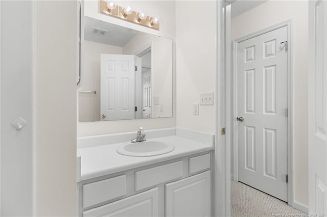 bathroom with visible vents and vanity