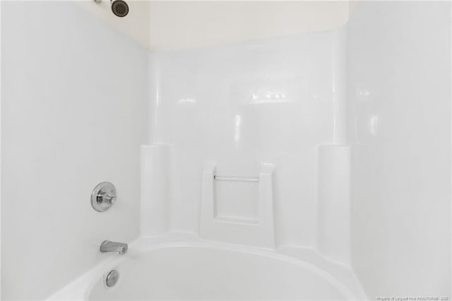 full bath featuring tub / shower combination