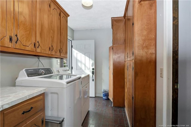 laundry room with cabinet space and washing machine and clothes dryer