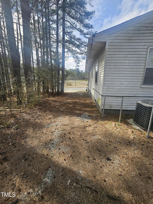 view of side of property featuring central AC unit