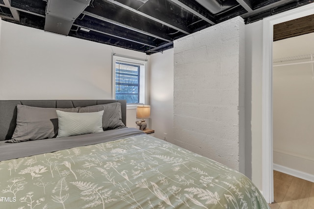 bedroom featuring wood finished floors