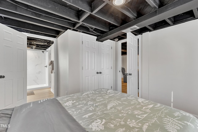 bedroom featuring a closet and wood finished floors