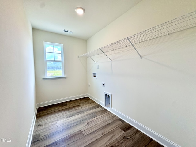 laundry area featuring baseboards, laundry area, hookup for a washing machine, and hookup for an electric dryer