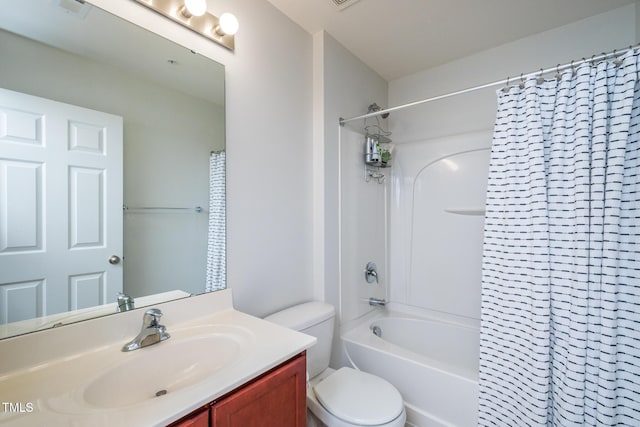 full bathroom featuring shower / bathtub combination with curtain, vanity, and toilet