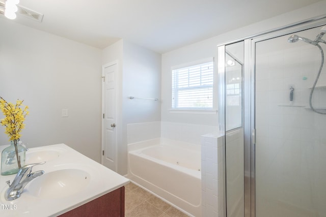 bathroom with a sink, visible vents, a bath, tile patterned floors, and a stall shower