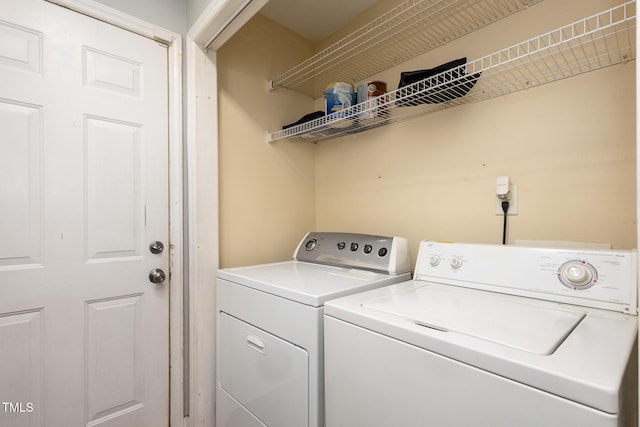 washroom featuring washer and dryer