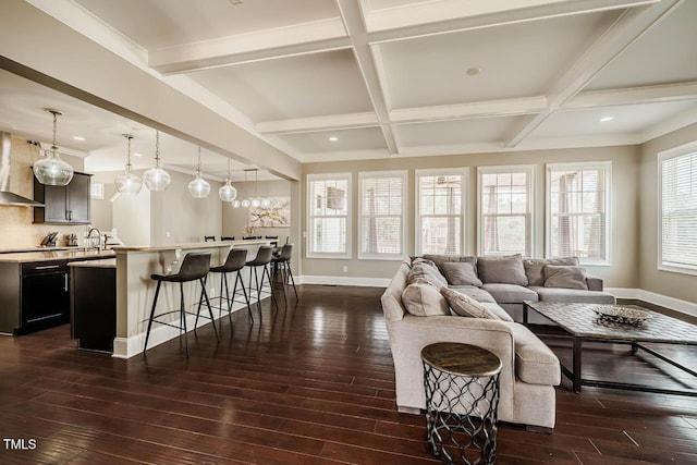 living room featuring beam ceiling, dark wood-style floors, baseboards, and coffered ceiling