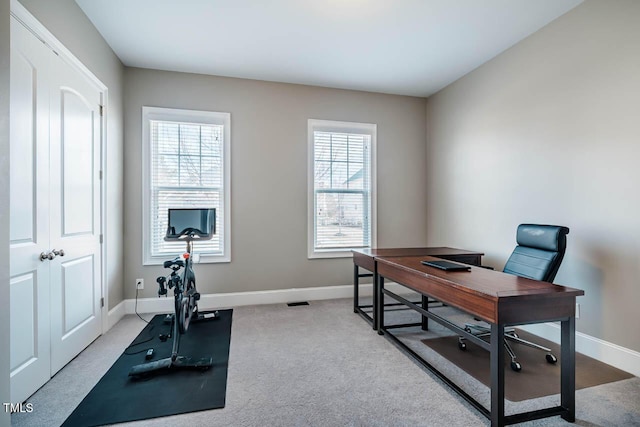 home office with baseboards and carpet