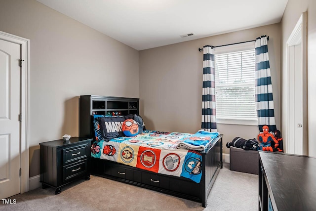 bedroom featuring light carpet, visible vents, and baseboards