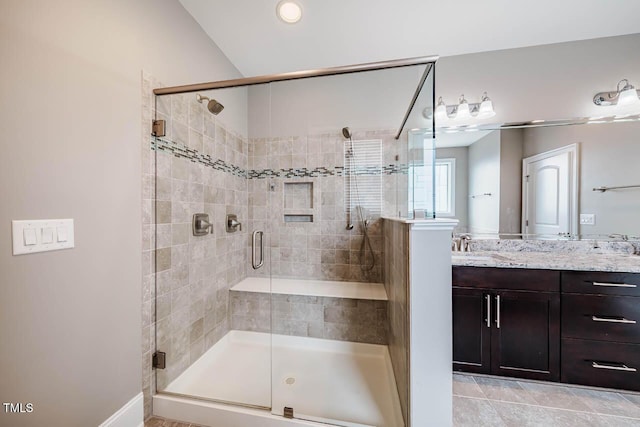 bathroom featuring vanity and a shower stall