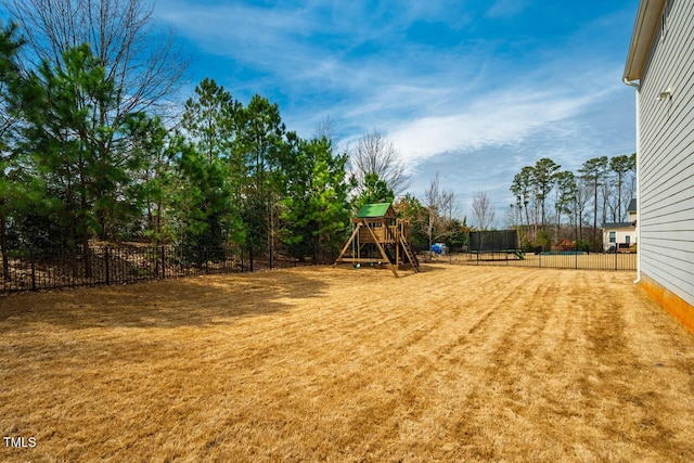 view of yard with a playground and fence