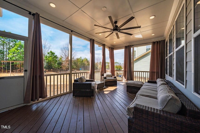 sunroom with a ceiling fan