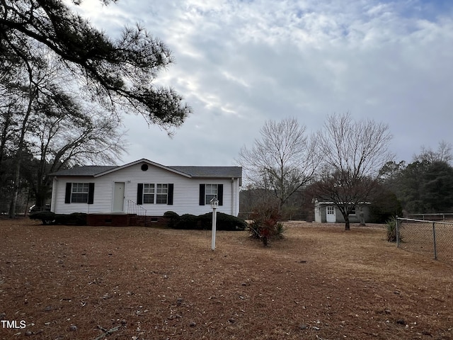 view of front of house featuring crawl space and fence