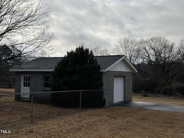 exterior space with fence and driveway