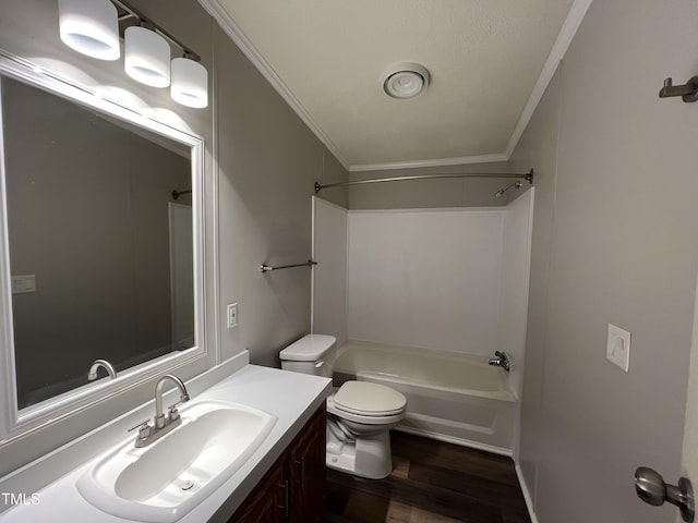 full bath featuring toilet, wood finished floors, vanity,  shower combination, and crown molding