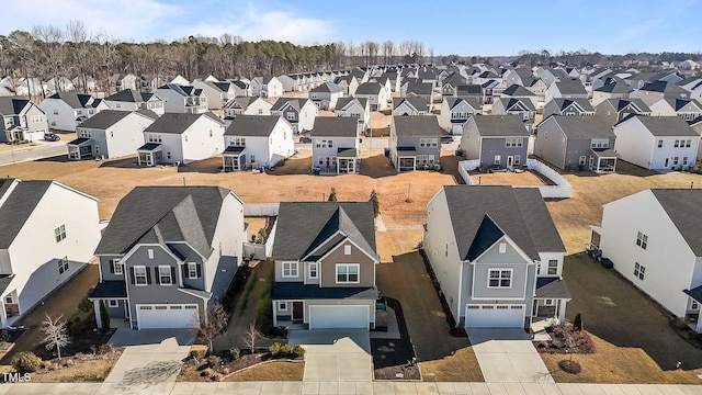 birds eye view of property with a residential view