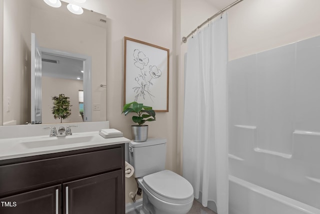 bathroom featuring toilet, shower / bath combination with curtain, and vanity