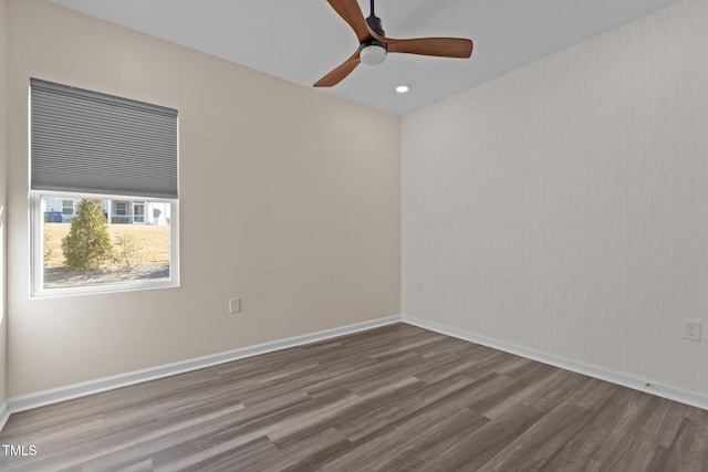 spare room featuring recessed lighting, ceiling fan, baseboards, and wood finished floors