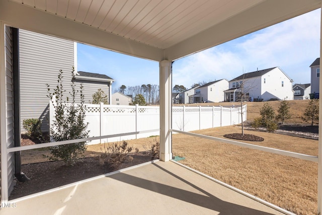 view of patio with a fenced backyard and a residential view