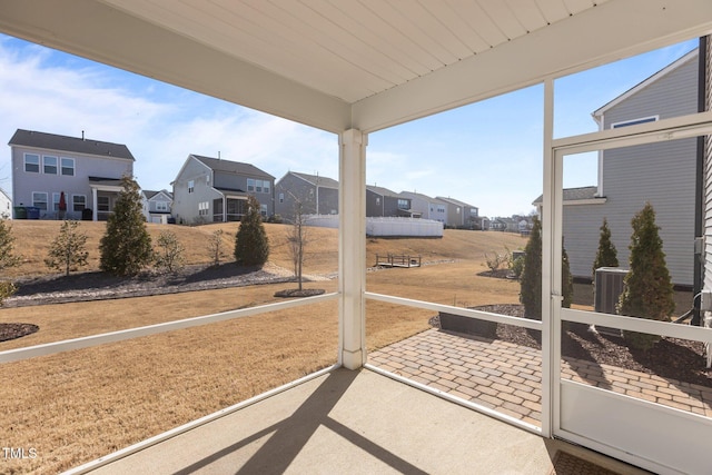 sunroom / solarium with a residential view