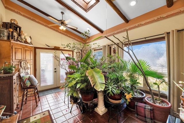 sunroom / solarium featuring lofted ceiling with beams and a ceiling fan