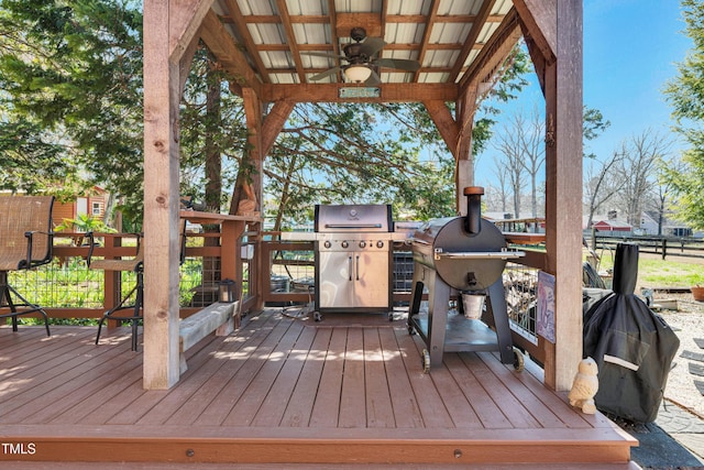 wooden deck featuring a grill and ceiling fan