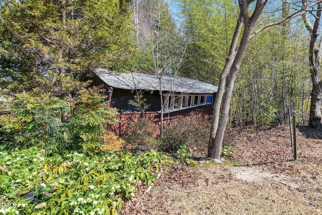 view of outbuilding featuring a wooded view