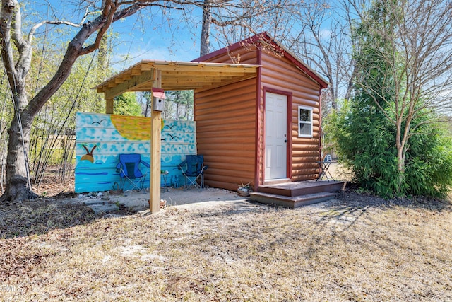 view of shed featuring fence