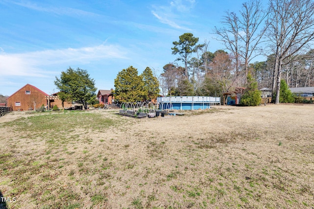 view of yard featuring an outdoor pool