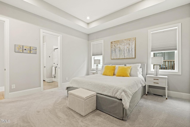 bedroom with recessed lighting, light carpet, and baseboards