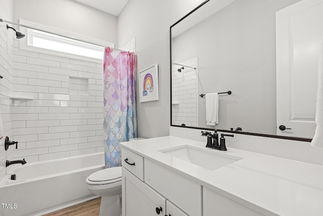 full bath featuring shower / bath combo, vanity, toilet, and wood finished floors