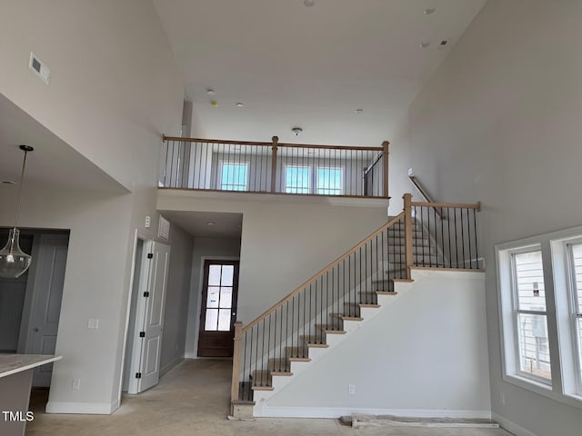 63 Daybreak Way, Fuquay Varina, NC 27526 - stairway with a towering ceiling and baseboards
